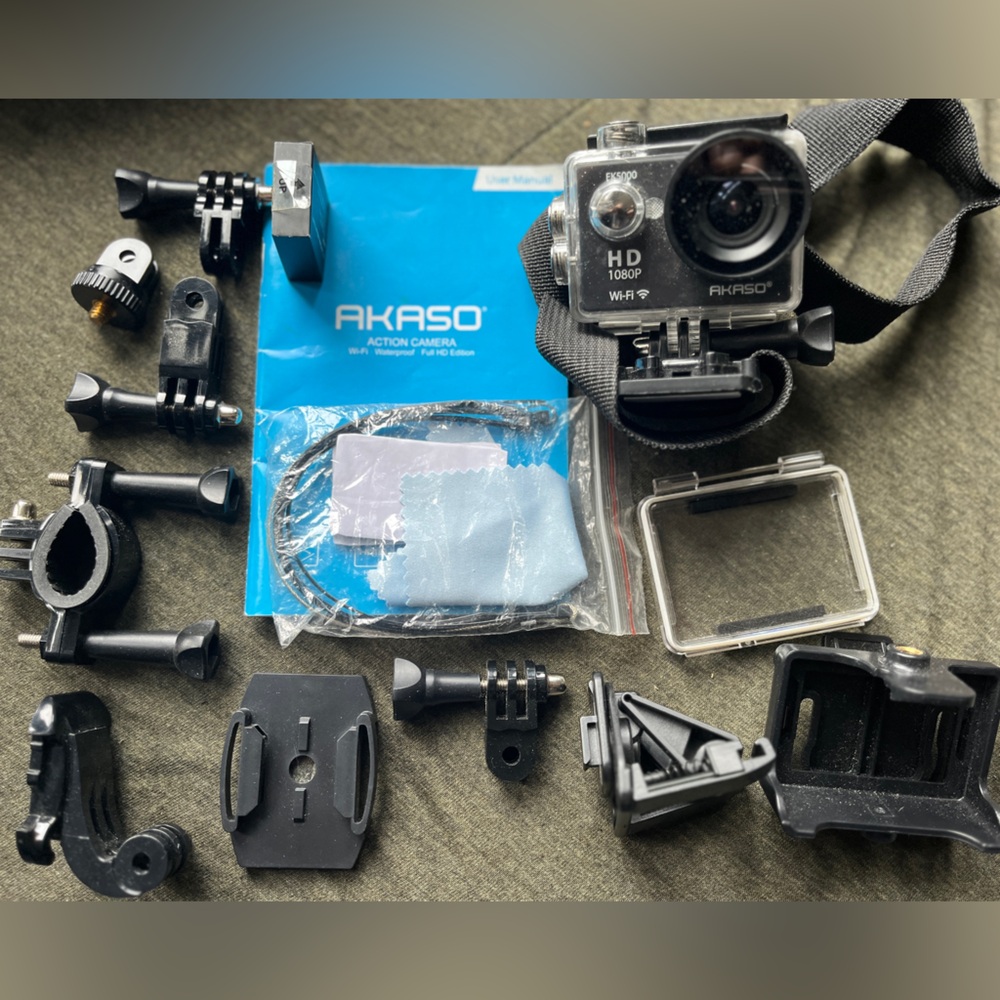 Like new go pro style action camera with large variety of mounts